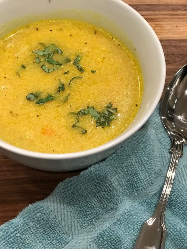 A steaming bowl of chicken soup