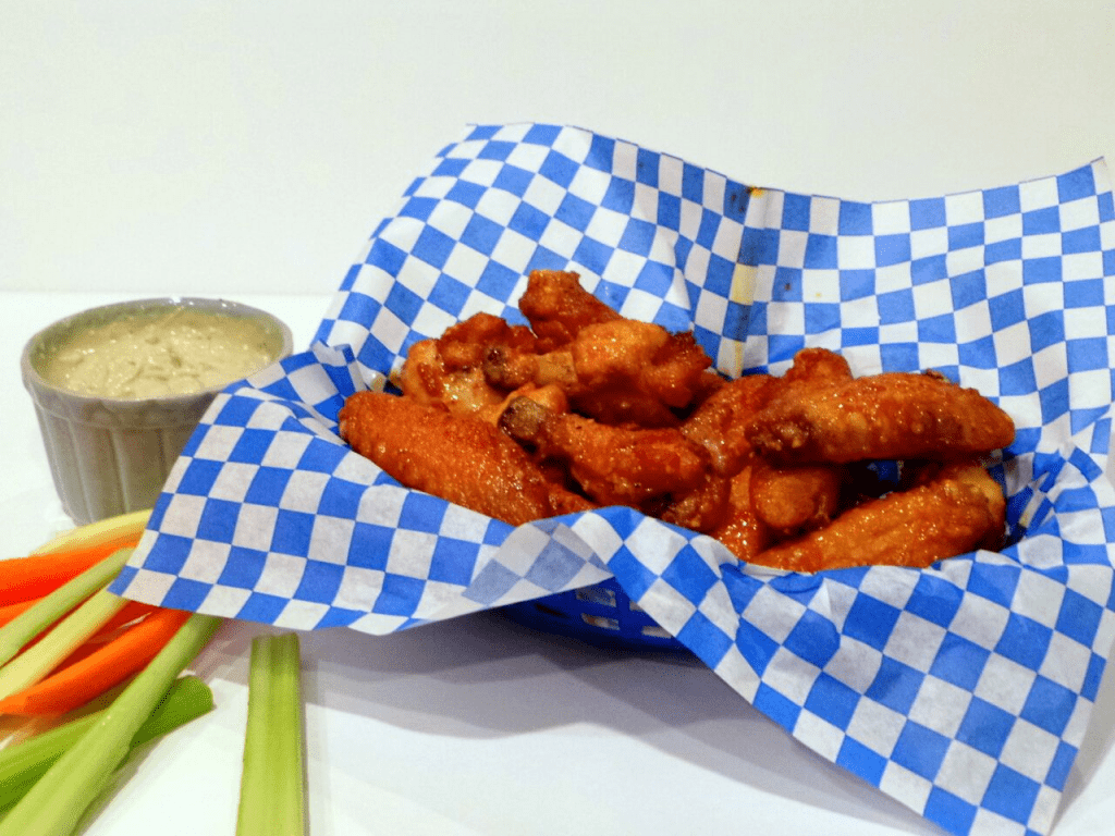 A close up of crispy hot chicken wings