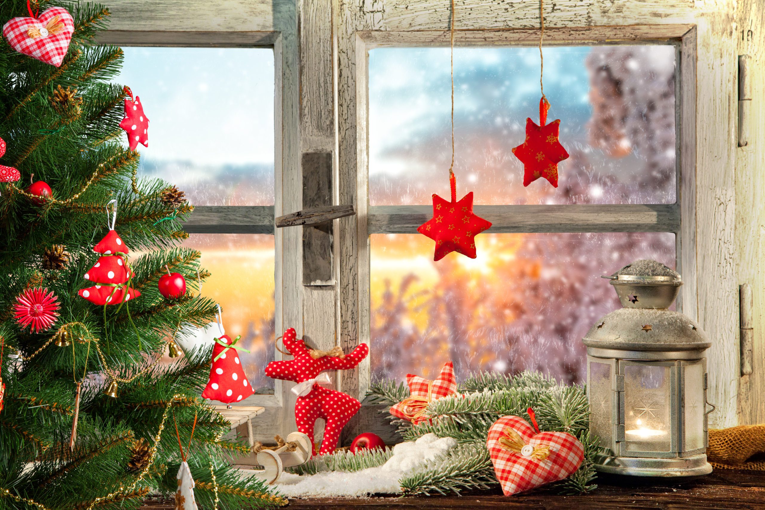 Atmospheric Christmas window sill decoration with beautiful sunset view