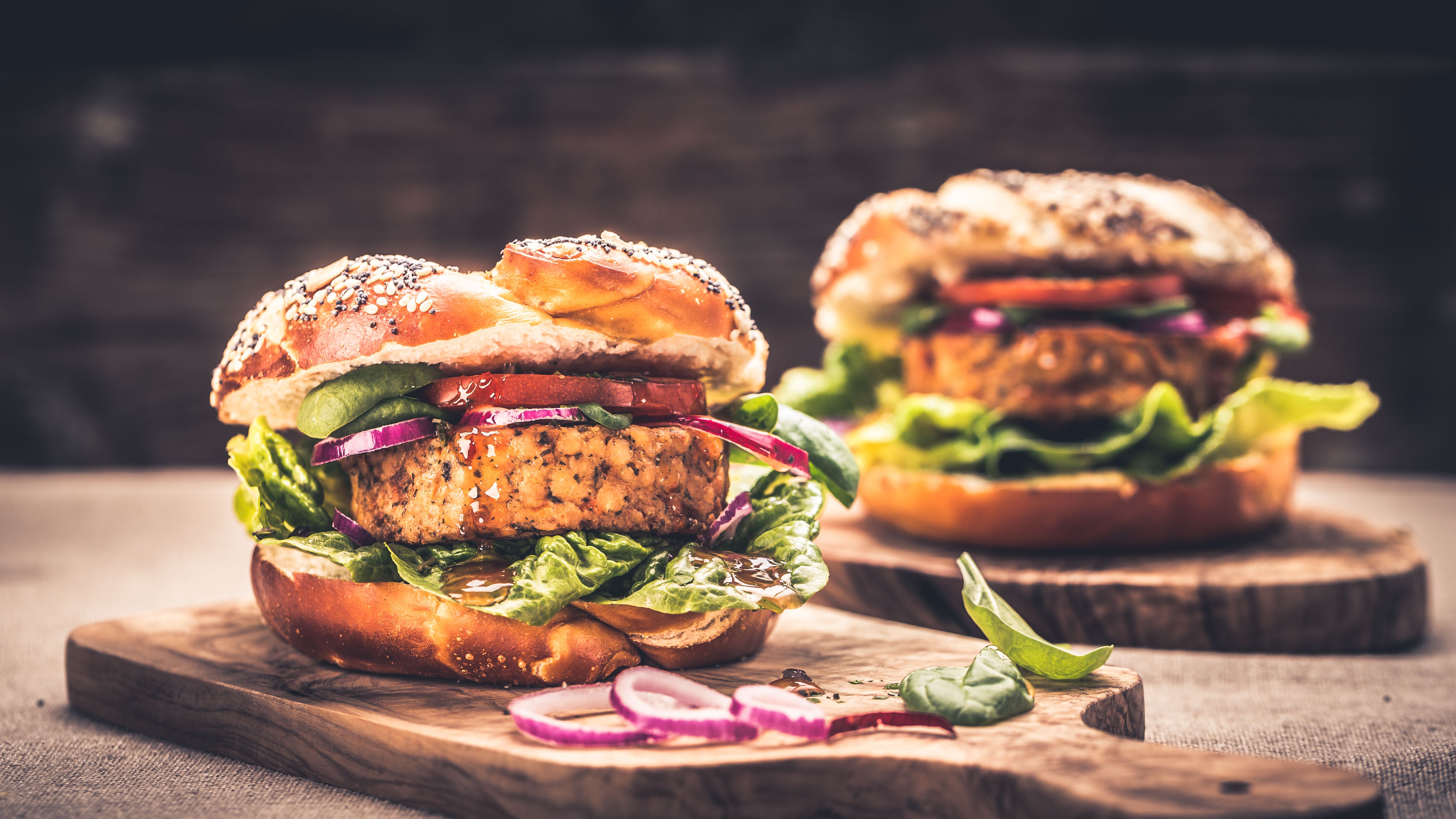 Healthy vegan burger with fresh vegetables and chili sauce