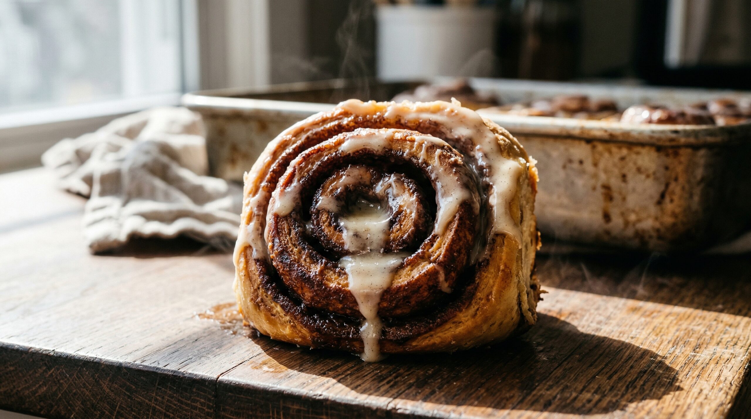 Stunning plated serving of Classic Cinnamon Rolls with Vanilla Glaze, a chef-tested recipe by Chef Jorj Morgan.